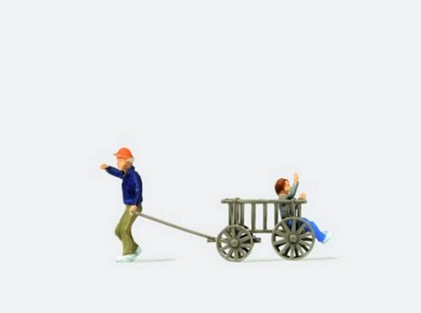 Preiser 28112 HO Scale Man Pulling a Child in a Wooden Cart