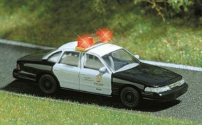 Busch 5629 HO Scale 1976 Dodge Monaco 4-Door Sedan with Working Lights - Assembled -- Police (Blue Body, White Canopy)