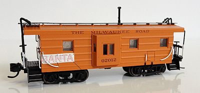 Fox Valley Models 91028 N Scale Milwaukee Road Low-Window Rib-Side Caboose w/Oil Door - Ready to Run -- Milwaukee Road #02012 (Restored Scheme, orange, 2000s Santa Train Banner)